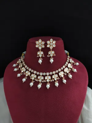 Kundan Choker/Necklace Set with Floral Design, Uncut Diamond Stones, and Jhumki Earrings