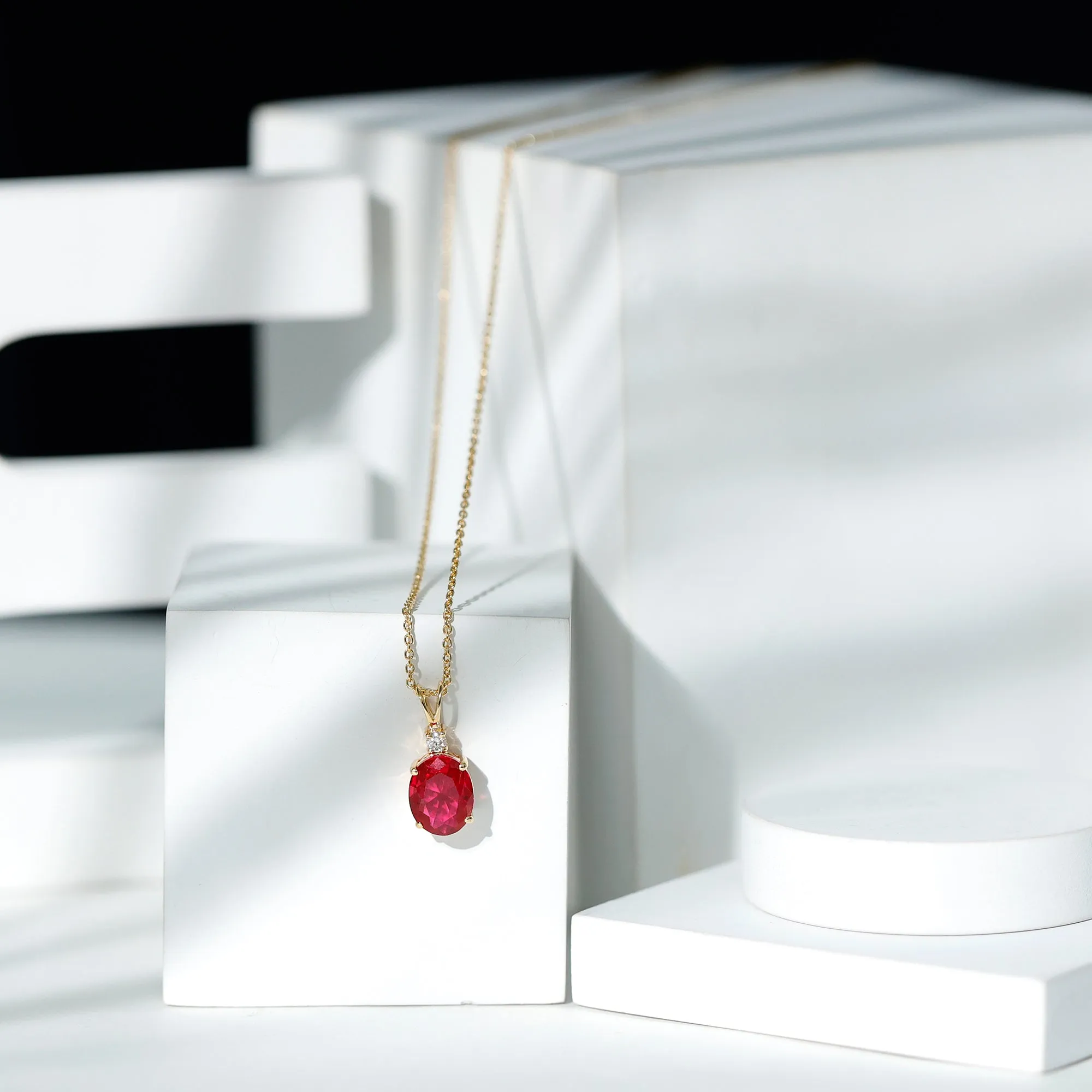Solitaire Created Ruby Oval Pendant with Moissanite