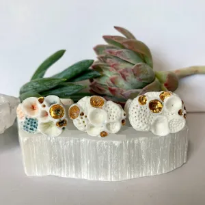 White with gold accent ‘rock coral’ ring